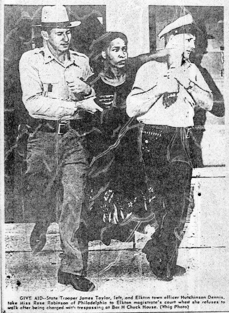 Police officers carry Rose Robinson of Philadelphia to court.