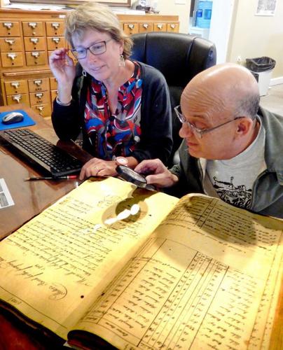 Cecil County volunteers examine colonial tax record