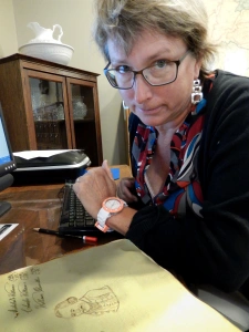 Historical Society volunteer examines colonial tax records.